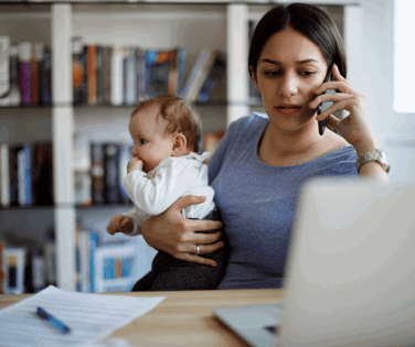 Woman holding baby on the phone