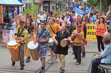 People playing drums as part of the Beeston Summer Fete parade