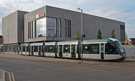 The Arc cinema in Beeston with the tram going past