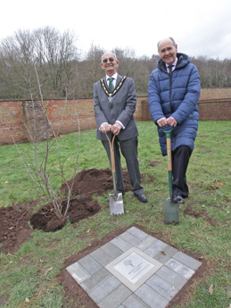 The Mayor, Councillor David Grindell, and the Lord-Lieutenant of Nottingham planting the tree of trees with a plaque commemorating the event