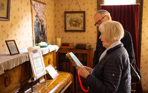 A couple reviewing one of the exhibits at the museum