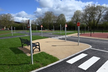Stapleford cycle training track with crossing, bench and stop and pedestrian signs