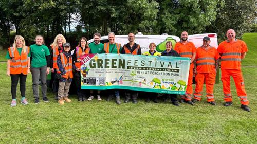 Staff at Green Festival with banner signage