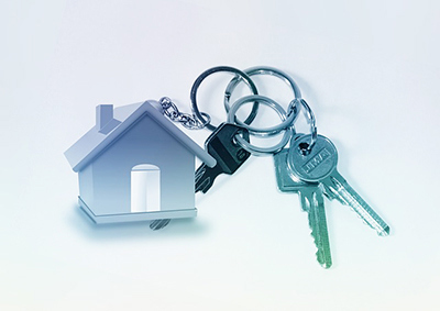 A set of keys with a house as a keychain