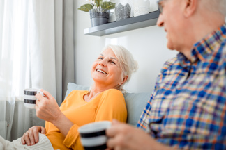 A couple having a hot drink
