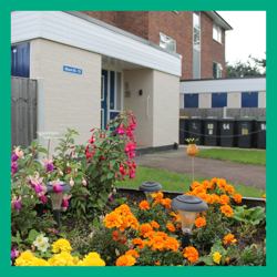 Templar Flats - General Needs -outside with flower beds