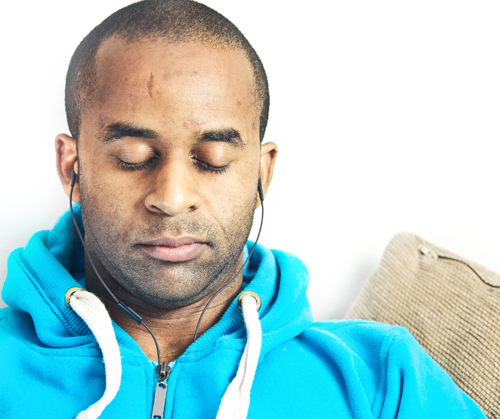 A man listening to music to relax