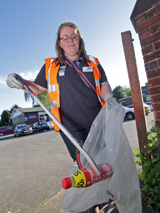 A local resident picking up litter