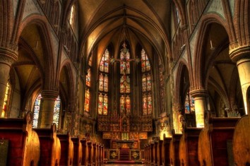 Image of the inside of a church looking down the aisle