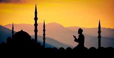 Image of someone kneeling to pray
