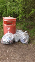 litter waste.jpg 4 Litter bags full beside a waste bin