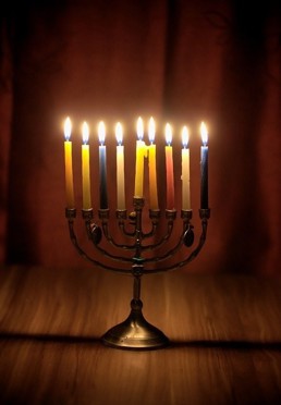 Nine lit candles in candle holder Nine lit candles in candle holder