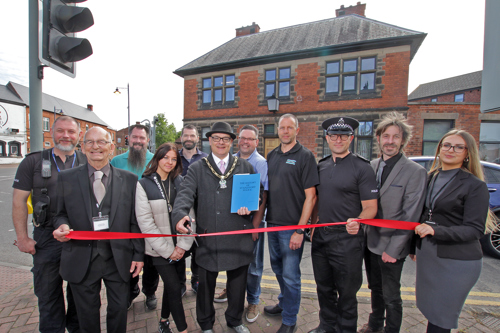 The Mayor of Broxtowe with a group of people cutting a ribbon in front of Stapleford Business Hub