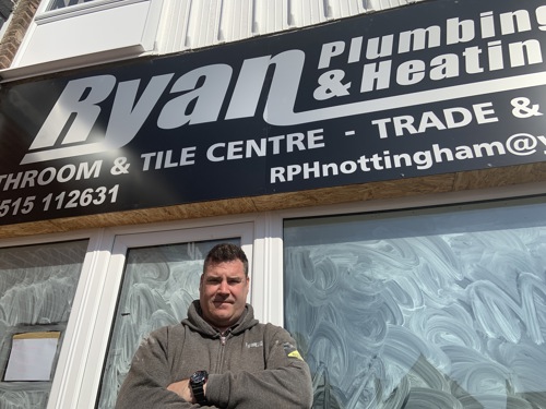 Ryan Leggat with his plumbing and heating van, Ryan has benefitted from the Town Centre recovery fund
