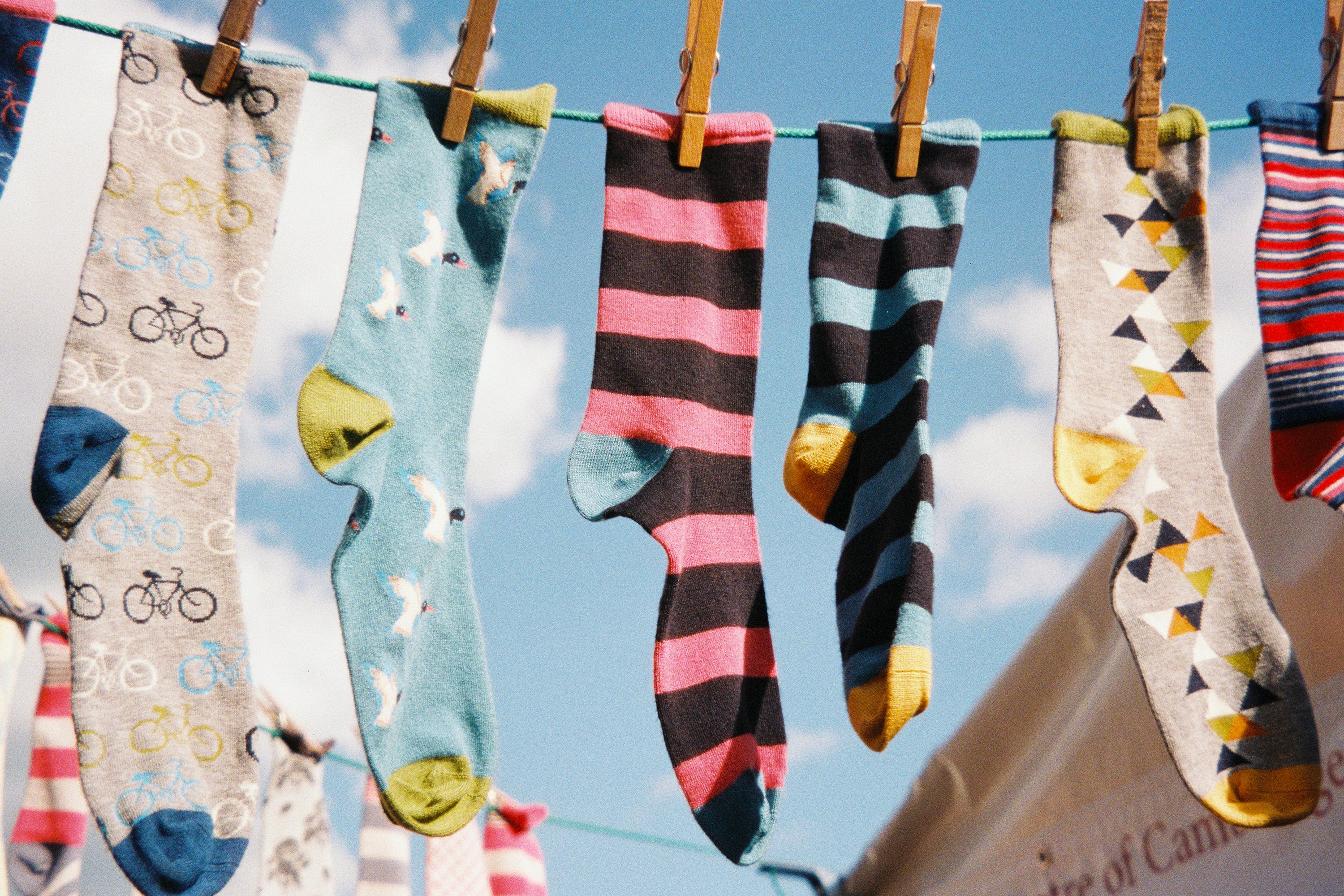 Socks drying outside on the washing line