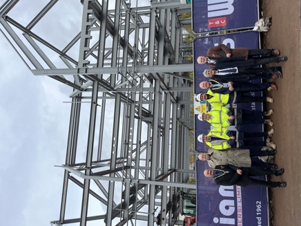 Contractors, council officers, the Broxtowe Mayor, Councillor Robert Bullock, Kimberley Town Mayor, Councillor Tony Mason in front of the framework at the new Kimberley Community and Business Hub site