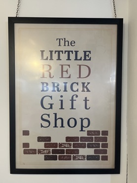 Sign that reads: The Little Red Brick Gift Shop