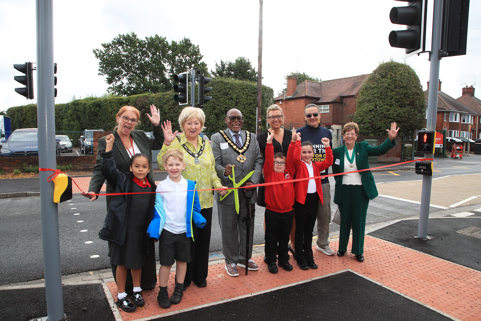 The Mayor with school children and board members opening the crossing