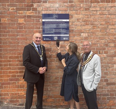 Mayor of Broxtowe, Councillor Robert Bullock, Museum and Collections officer Carolyn Melbourne, and the Mayor of Eastwood, Councillor Ken Woodhead outside stop one on the new trail, the D.H. Lawrence Birthplace Museum