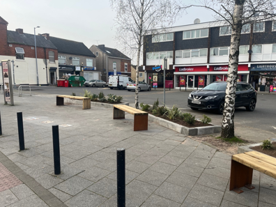 The Hollies Square with 3 new wooden benches and planters