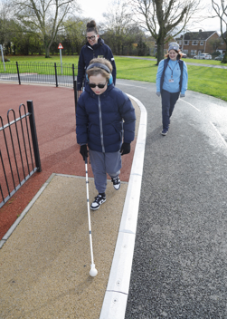 A visually impaired child using the new track improvements