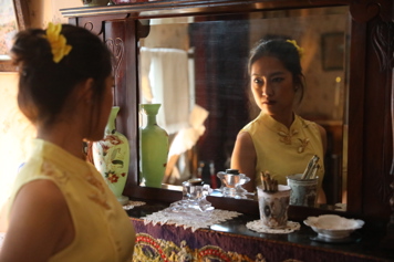 Exchange student Rhea, looking into the mirror in the Parlour at the D.H. Lawrence Birthplace Museum