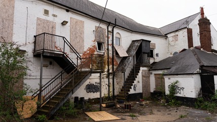 Old rock in Stapleford with boarded up windows