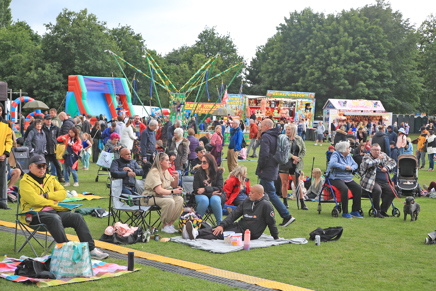 People having picnics in front of the stage at Hemlock Happening