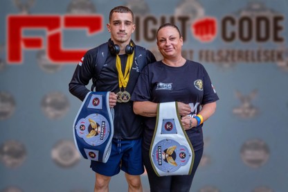 Eastwood boxer Taylor Brown with 2 belts and his mother