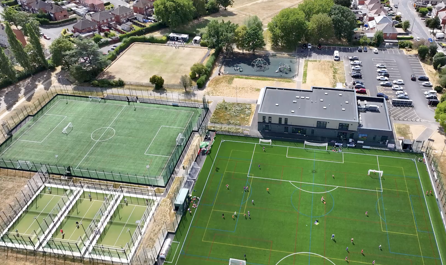 Arial shot of the Stapleford Community Pavilion with people using the pitches and courts
