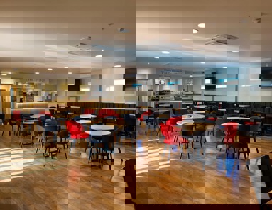 The pavilion inside, with red and black seating.