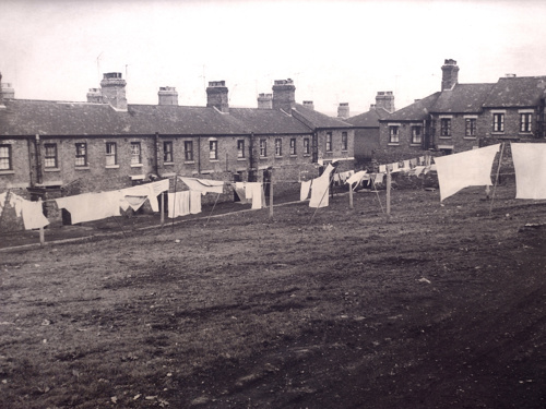 Black and white image depicting "The Squares" mining cottages on Princes Street